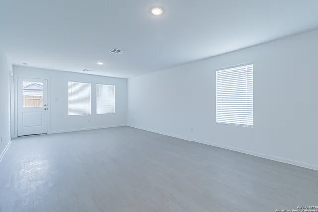 an empty room with windows
