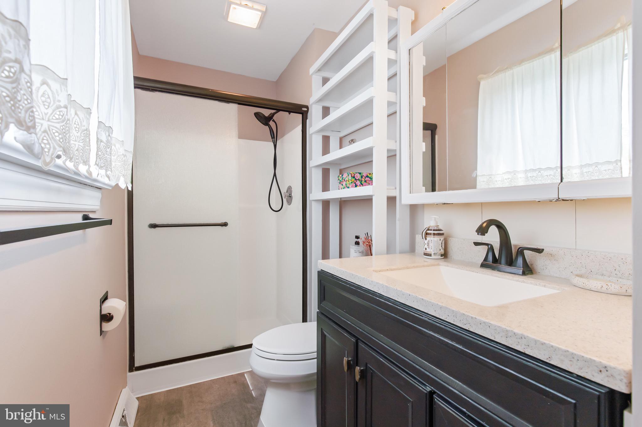 575 Millcross Road Lancaster, PA 17601 - Photo 26 of 47 a bathroom with a sink a toilet and shower