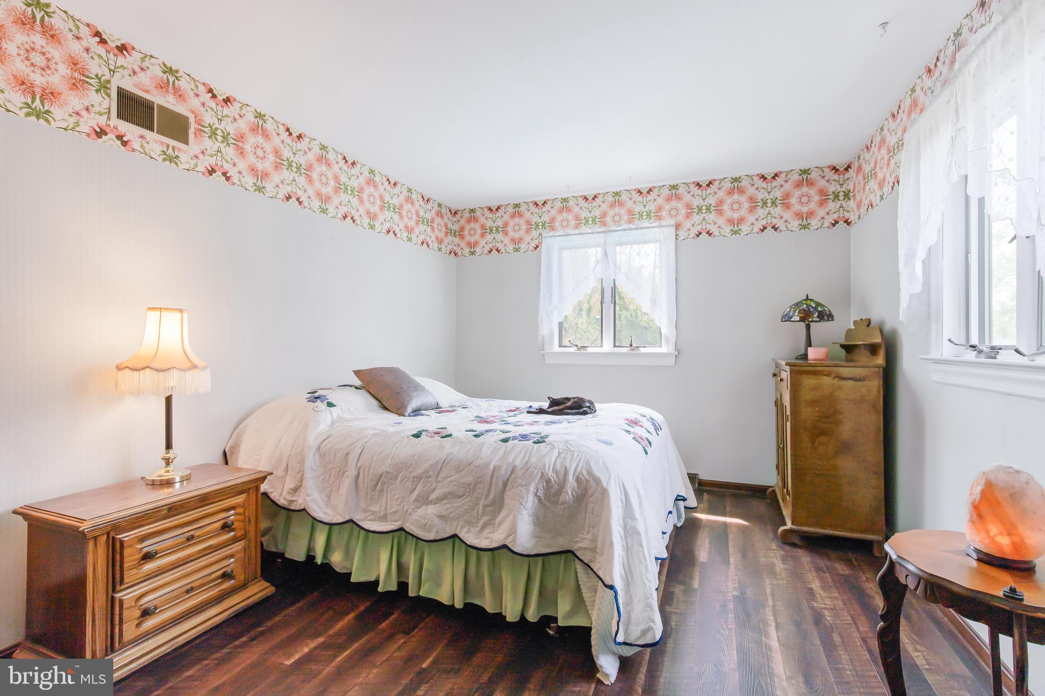 575 Millcross Road Lancaster, PA 17601 - Photo 29 of 47 a bedroom with a bed and wooden floor