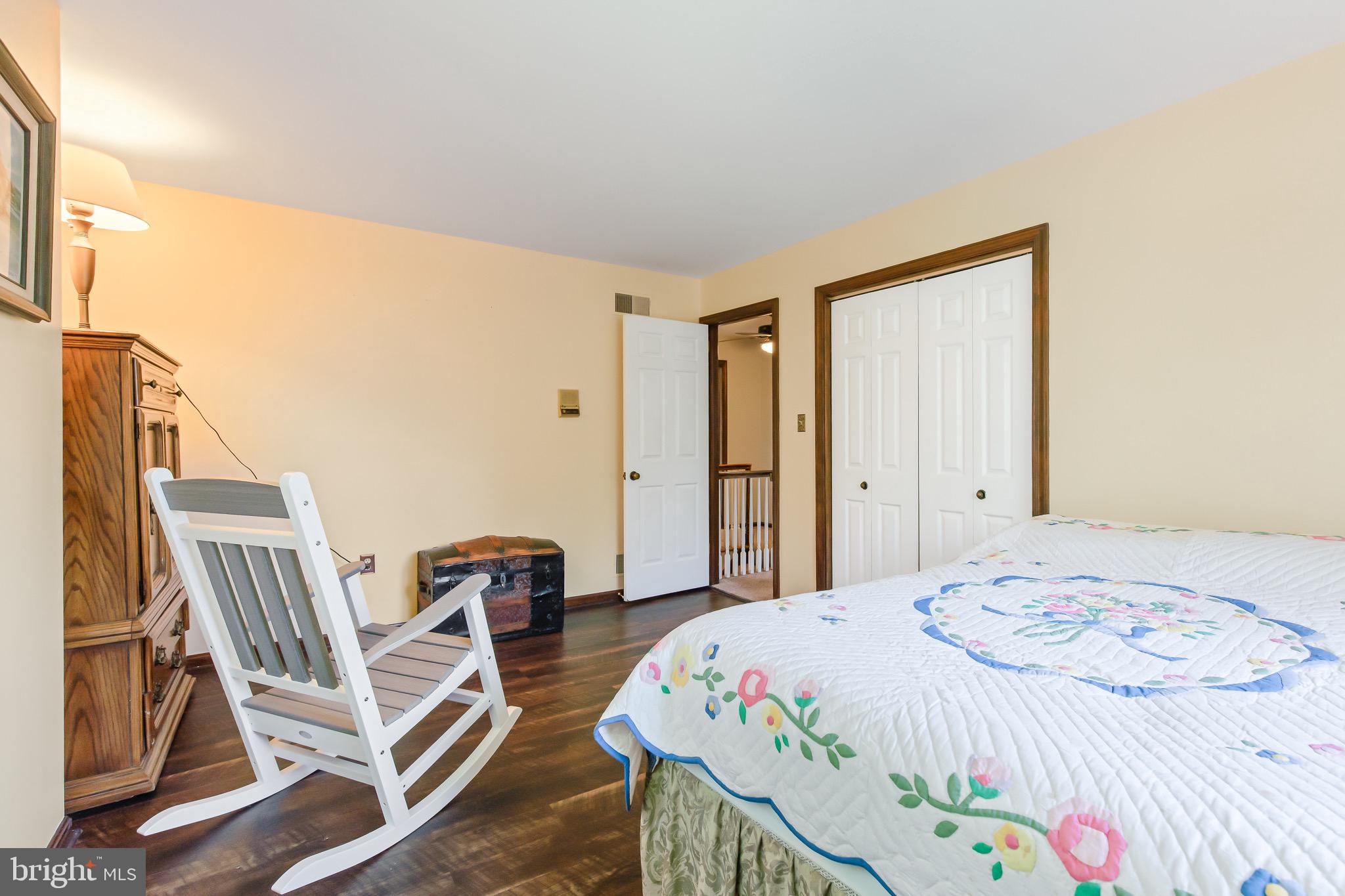 575 Millcross Road Lancaster, PA 17601 - Photo 32 of 47 a bedroom with a bed and wooden floor
