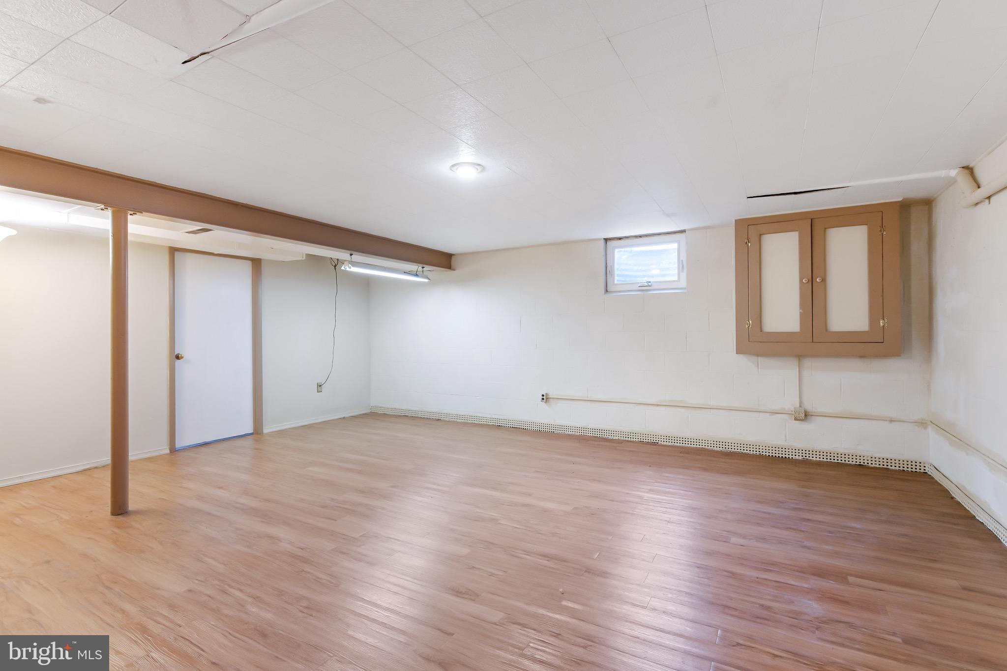 575 Millcross Road Lancaster, PA 17601 - Photo 38 of 47 an empty room with wooden floor and windows
