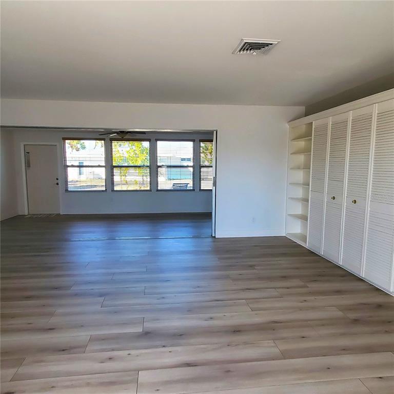 531 Neponsit Drive Venice, FL 34293 - Photo 17 of 37 wooden floor in an empty room with a window