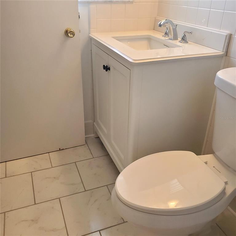 531 Neponsit Drive Venice, FL 34293 - Photo 25 of 37 a bathroom with a sink a toilet and mirror