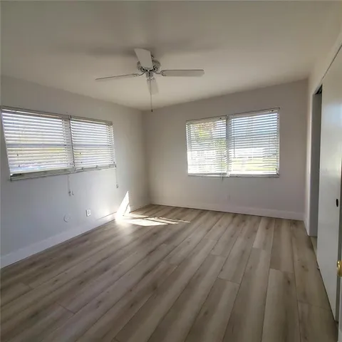 a bathroom with a sink toilet and a mirror