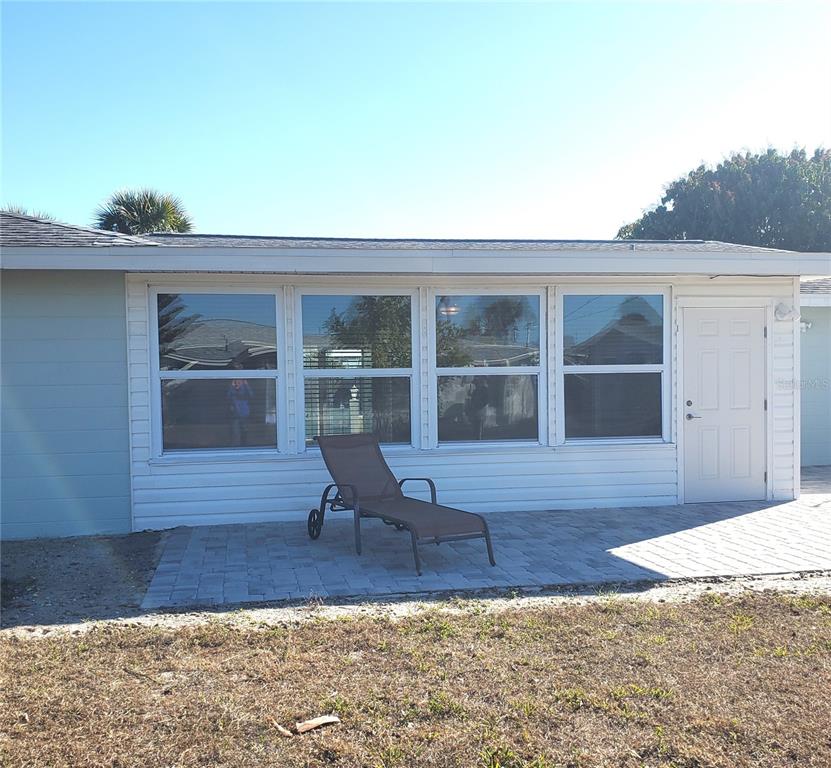 531 Neponsit Drive Venice, FL 34293 - Photo 32 of 37 a bench sitting in front of a house