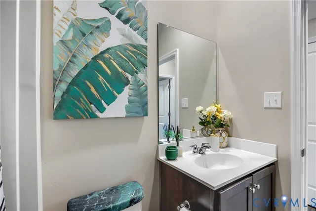 a bathroom with a sink and mirror