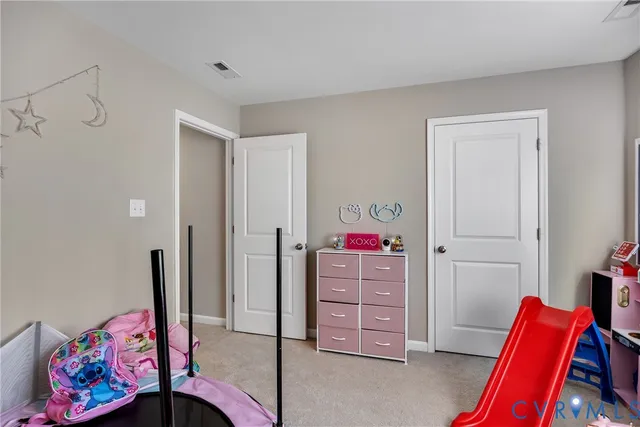 a bedroom with a bed and furniture