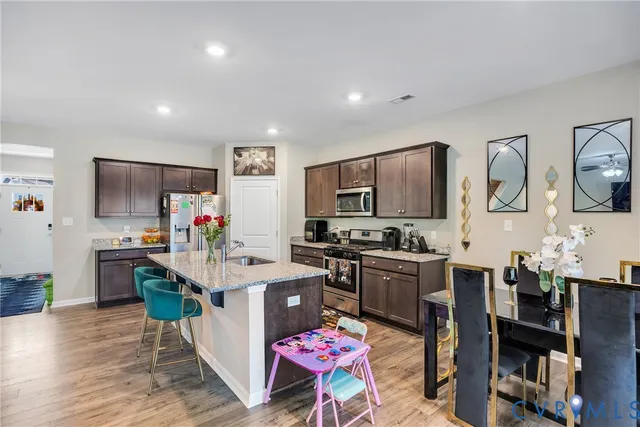 a kitchen that has a lot of cabinets and refrigerator