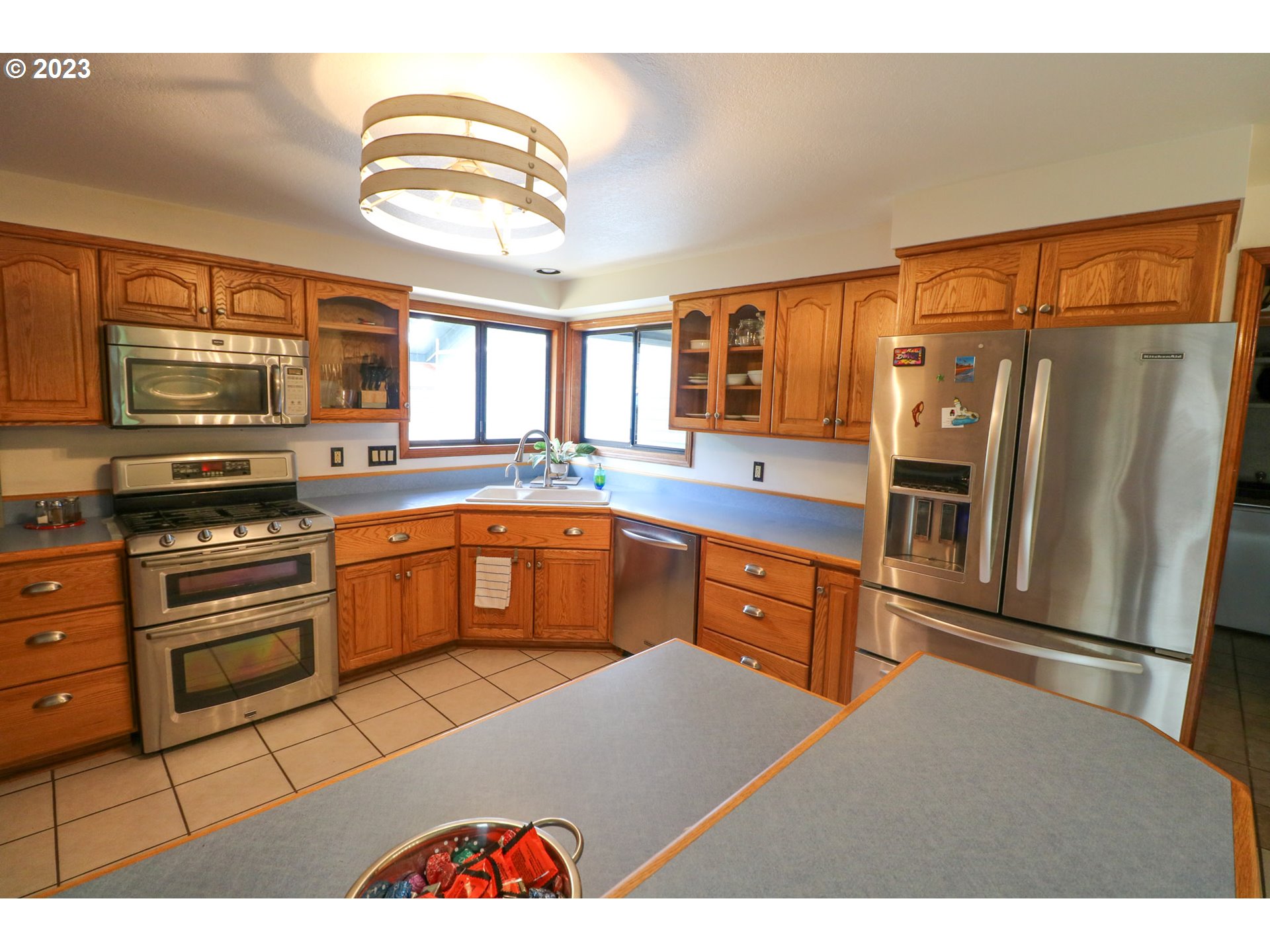 2075 Timberline Drive Coos Bay, OR 97420 - Photo 18 of 39 a kitchen with stainless steel appliances granite countertop a refrigerator and a stove top oven