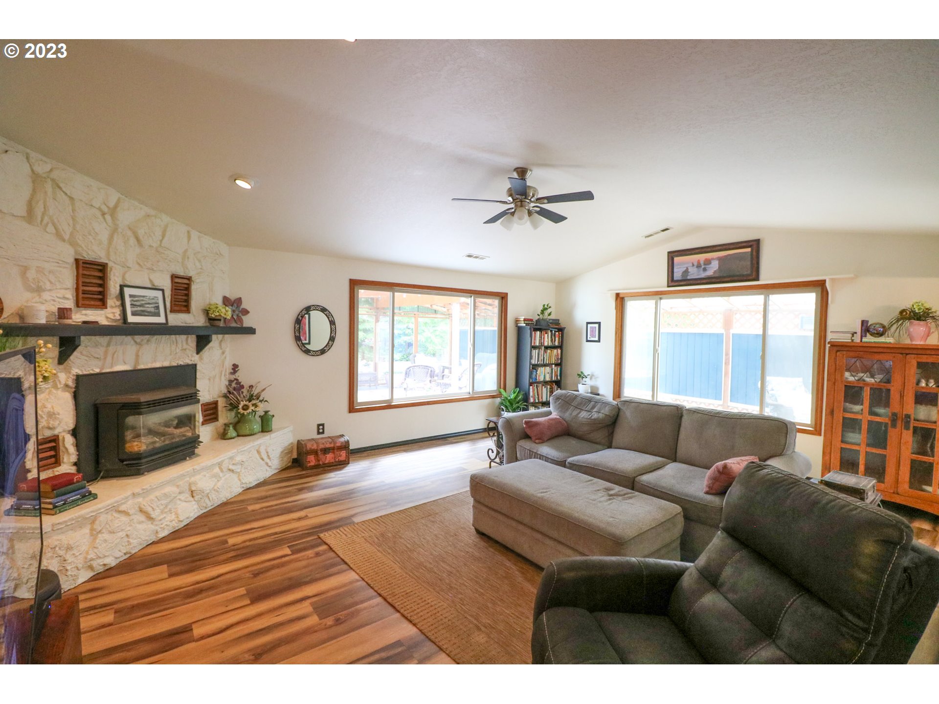 2075 Timberline Drive Coos Bay, OR 97420 - Photo 26 of 39 a living room with furniture and a fireplace