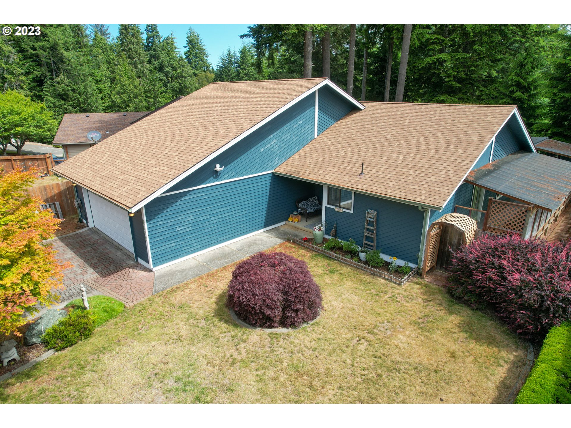 2075 Timberline Drive Coos Bay, OR 97420 - Photo 3 of 39 a view of house with backyard and trees
