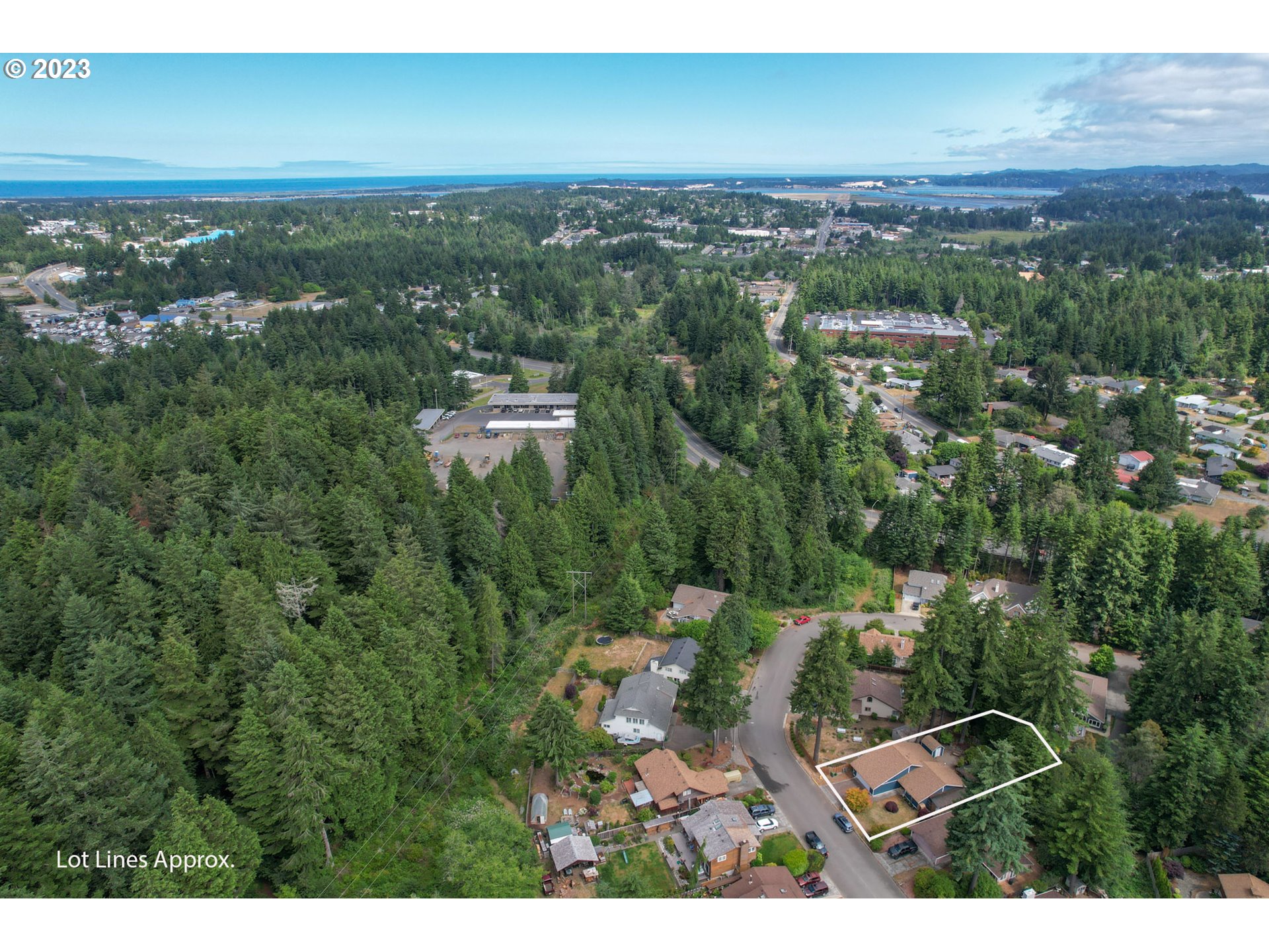 2075 Timberline Drive Coos Bay, OR 97420 - Photo 39 of 39 an aerial view of residential houses with outdoor space and trees