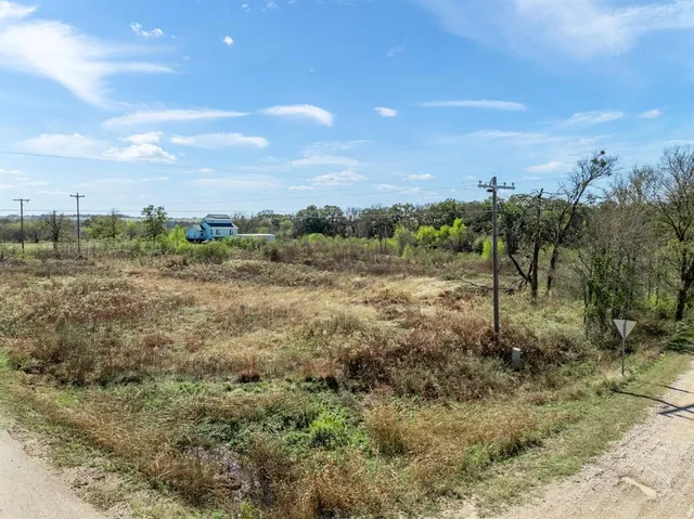 a view of a lake with houses in the back