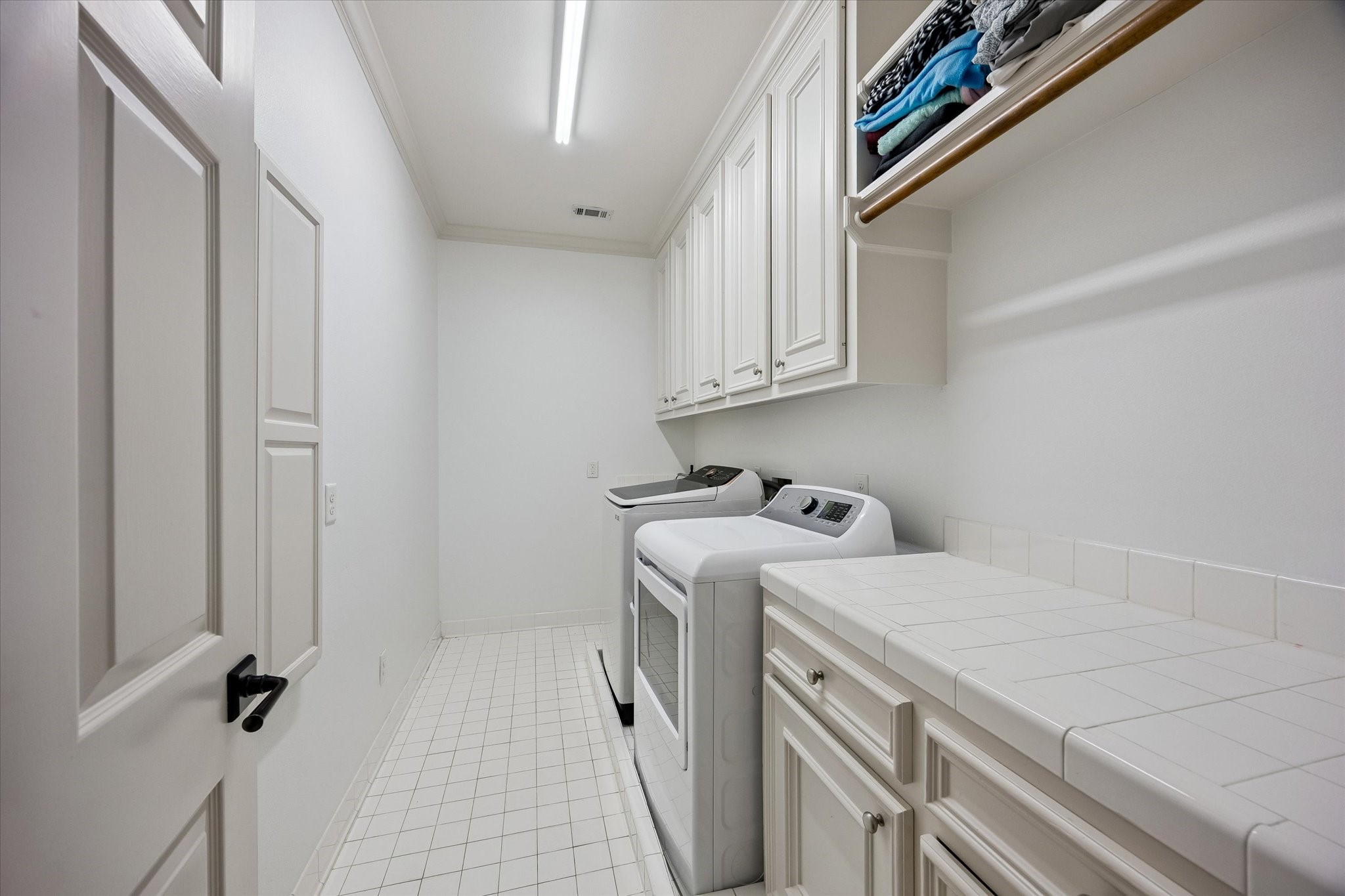 6358 Auden Street Houston, TX 77005 - Photo 21 of 50 a utility room with dryer and washer