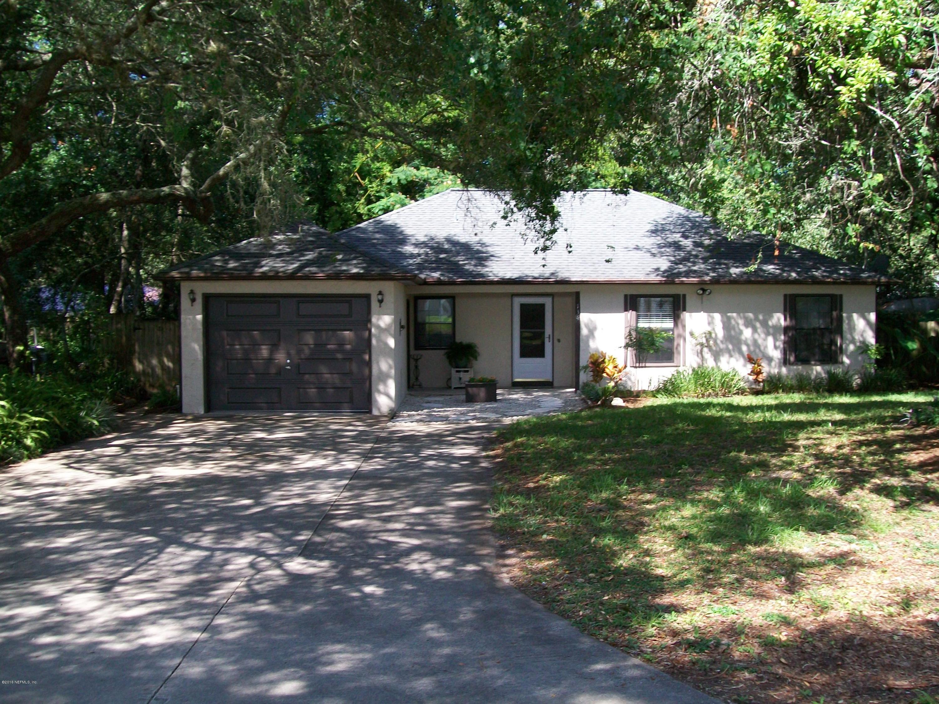 134 Dory Road St. Augustine, FL 32086 - Photo 1 of 25 a front view of a house with garden