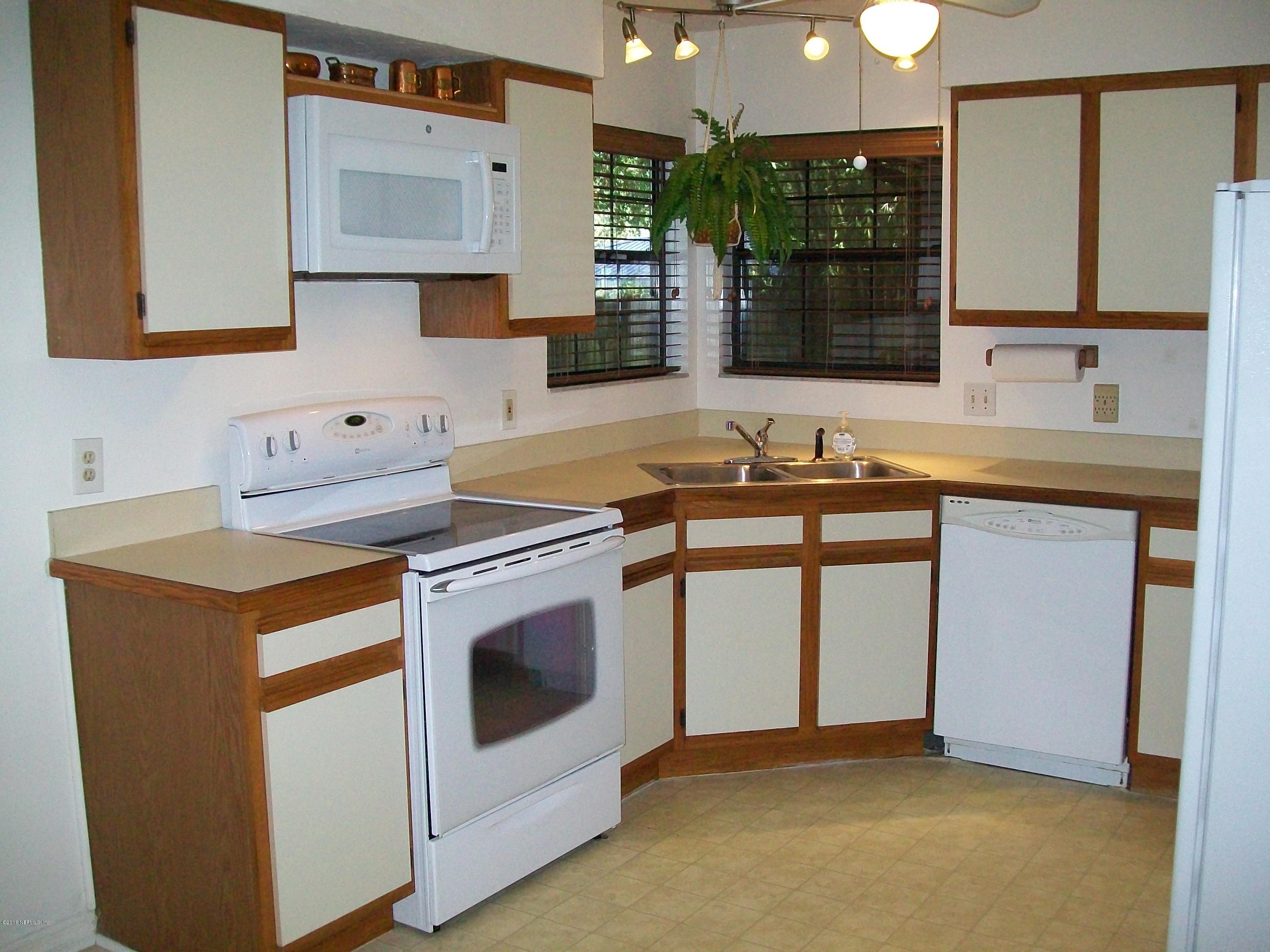 134 Dory Road St. Augustine, FL 32086 - Photo 12 of 25 a kitchen that has a sink and a stove in it