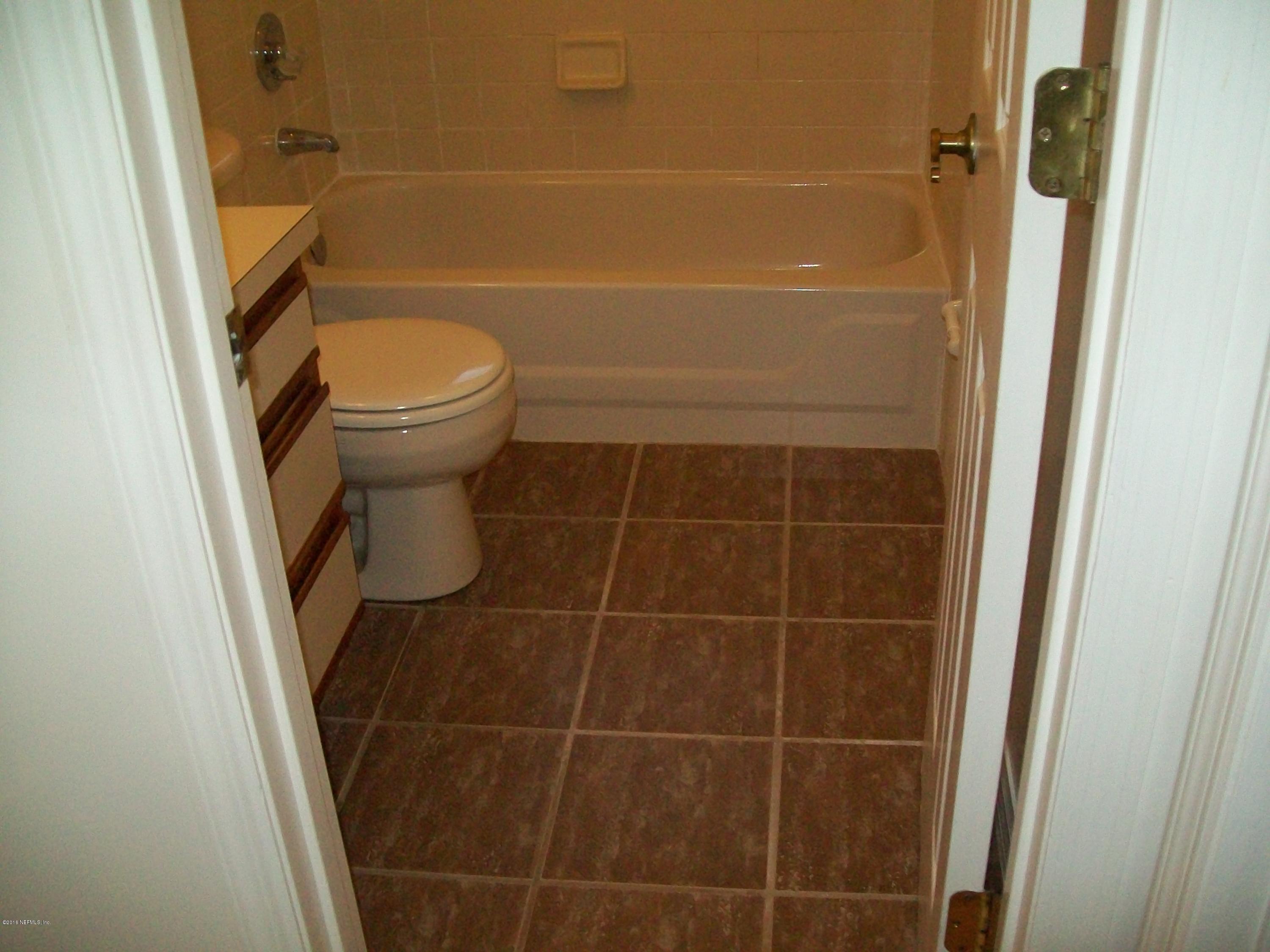 134 Dory Road St. Augustine, FL 32086 - Photo 18 of 25 a bathroom with a toilet and a shower