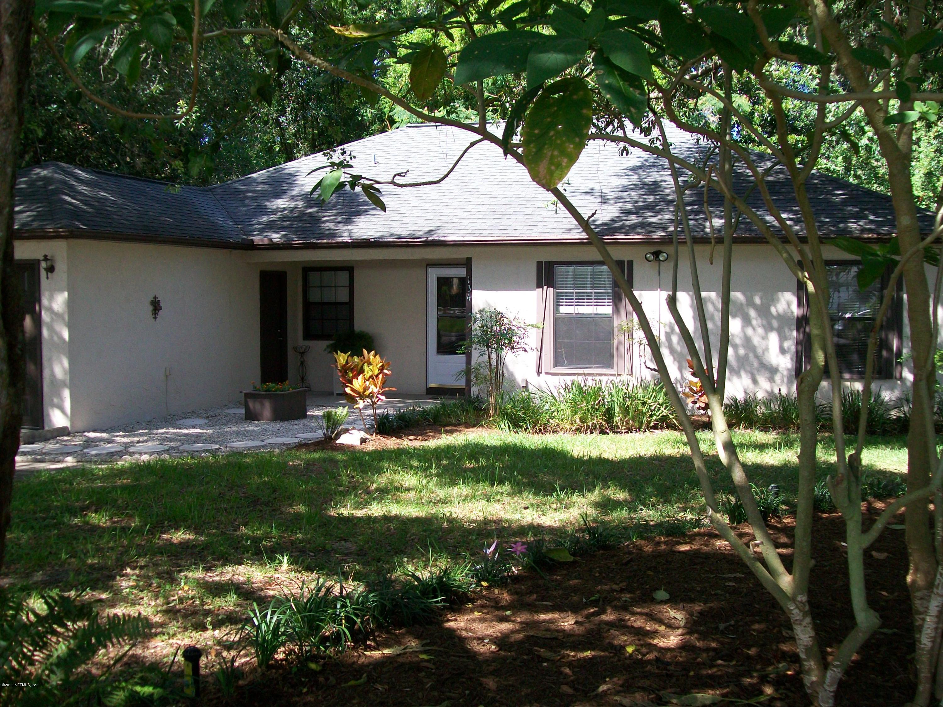 134 Dory Road St. Augustine, FL 32086 - Photo 2 of 25 a front view of a house with garden