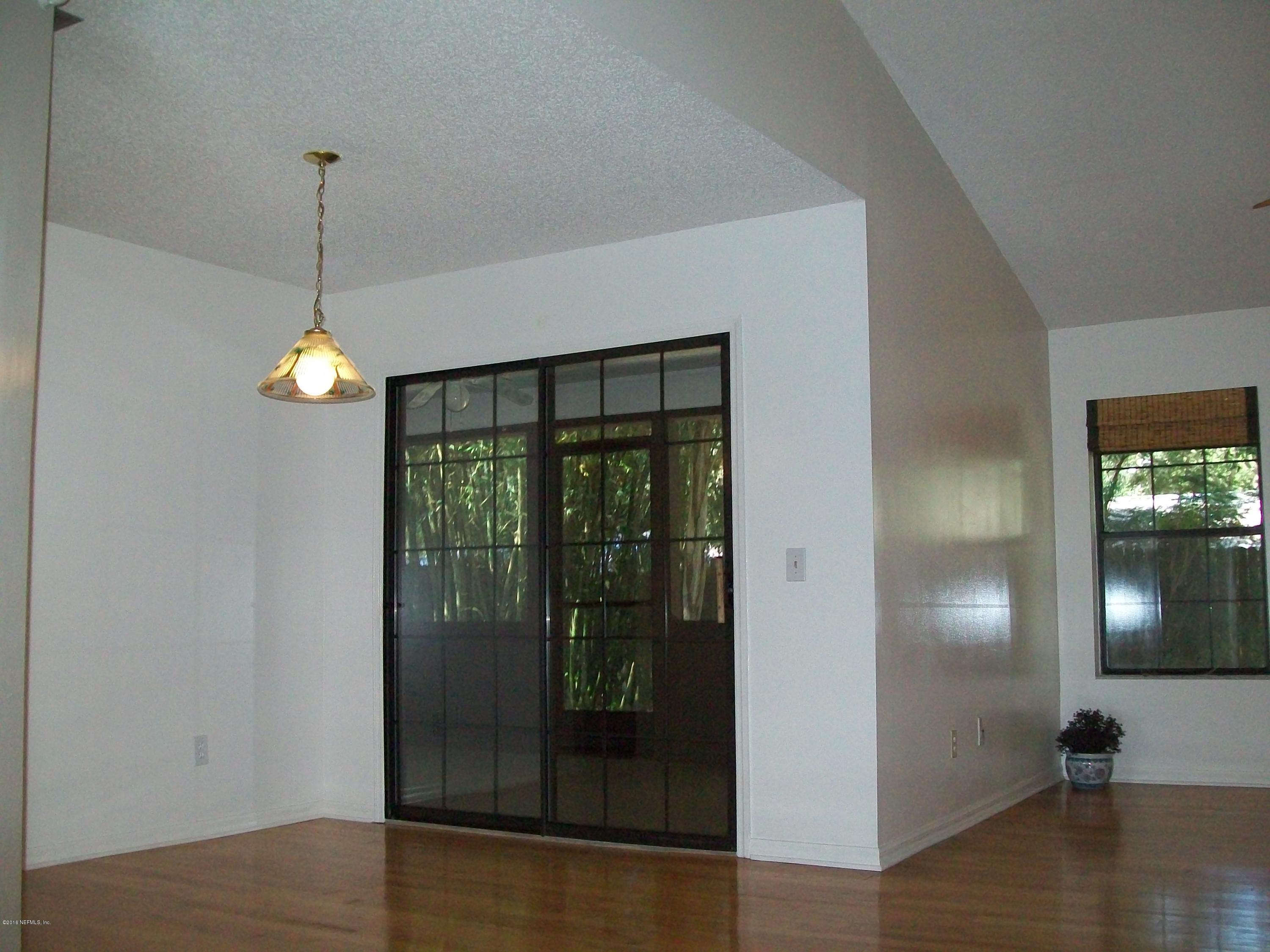 134 Dory Road St. Augustine, FL 32086 - Photo 10 of 25 a view of a hallway with windows