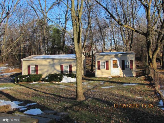 7609 Bull Run Road Manassas, VA 20111 - Photo 15 of 15 a front view of a house with a yard