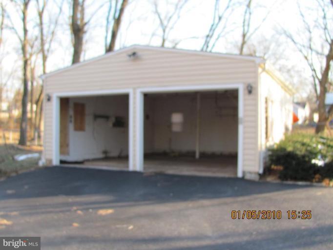 7609 Bull Run Road Manassas, VA 20111 - Photo 4 of 15 a view of a house with a door and garage