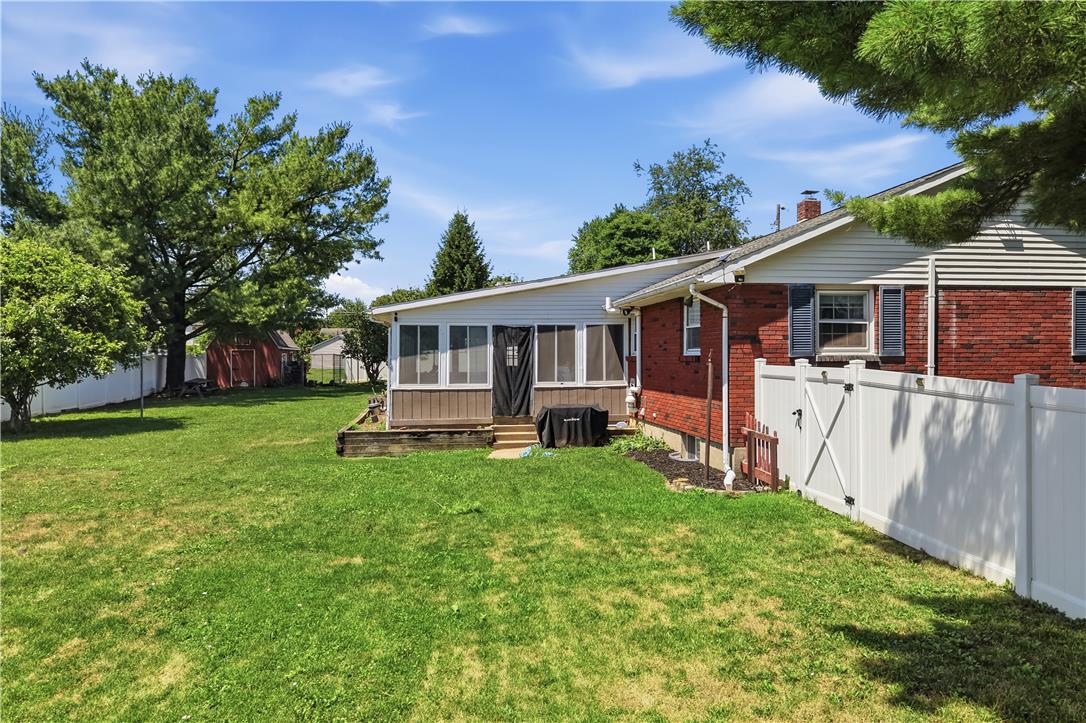 2918 Keystone Street Bethlehem, PA 18020 - Photo 36 of 54 A well-maintained lawn extends to a private fenced yard with a charming detached shed and a sunroom.