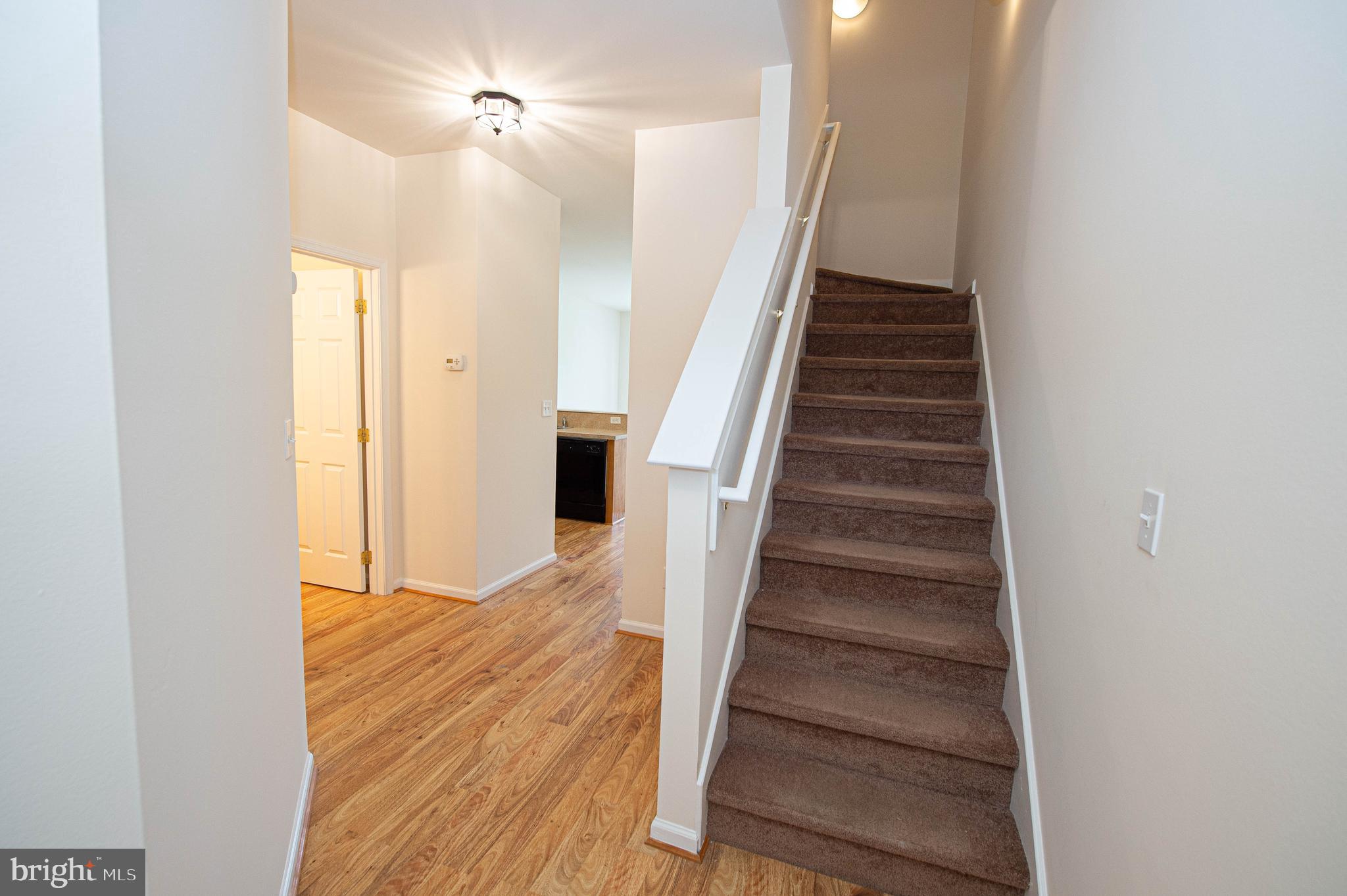 438 Parkview Court, Unit E Salisbury, MD 21804 - Photo 14 of 95 a view of entryway and hall with wooden floor