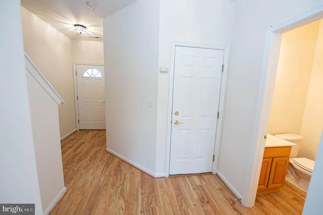 a kitchen with granite countertop a stove a sink and a microwave