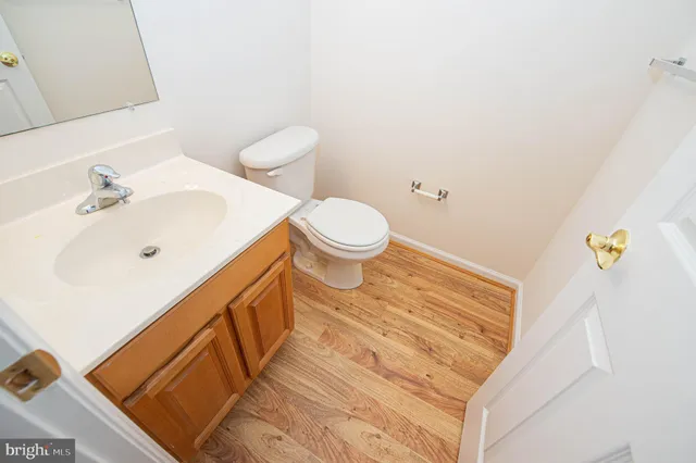 a kitchen with a refrigerator and a stove top oven