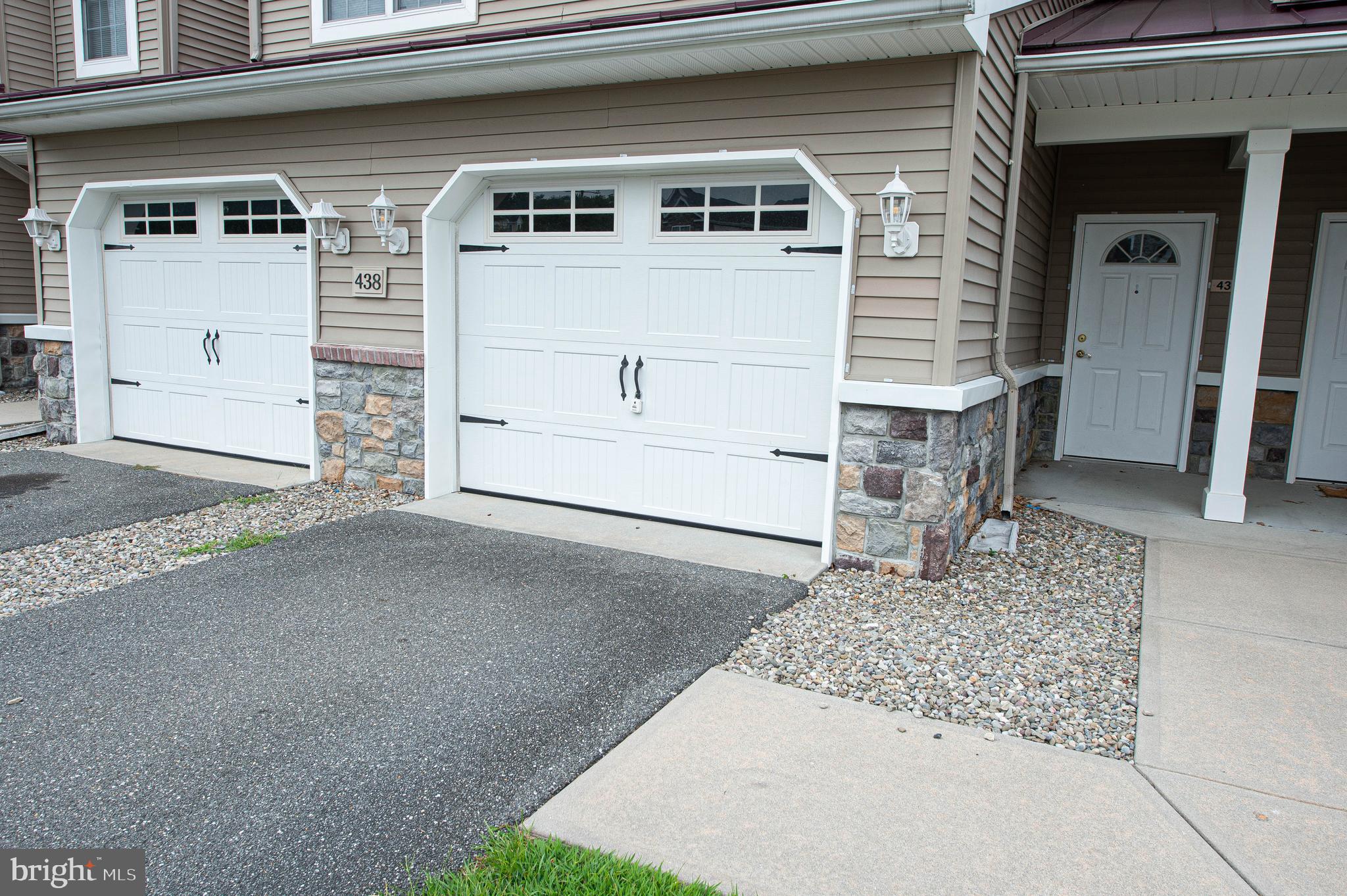 438 Parkview Court, Unit E Salisbury, MD 21804 - Photo 4 of 95 a front view of a house with a garage