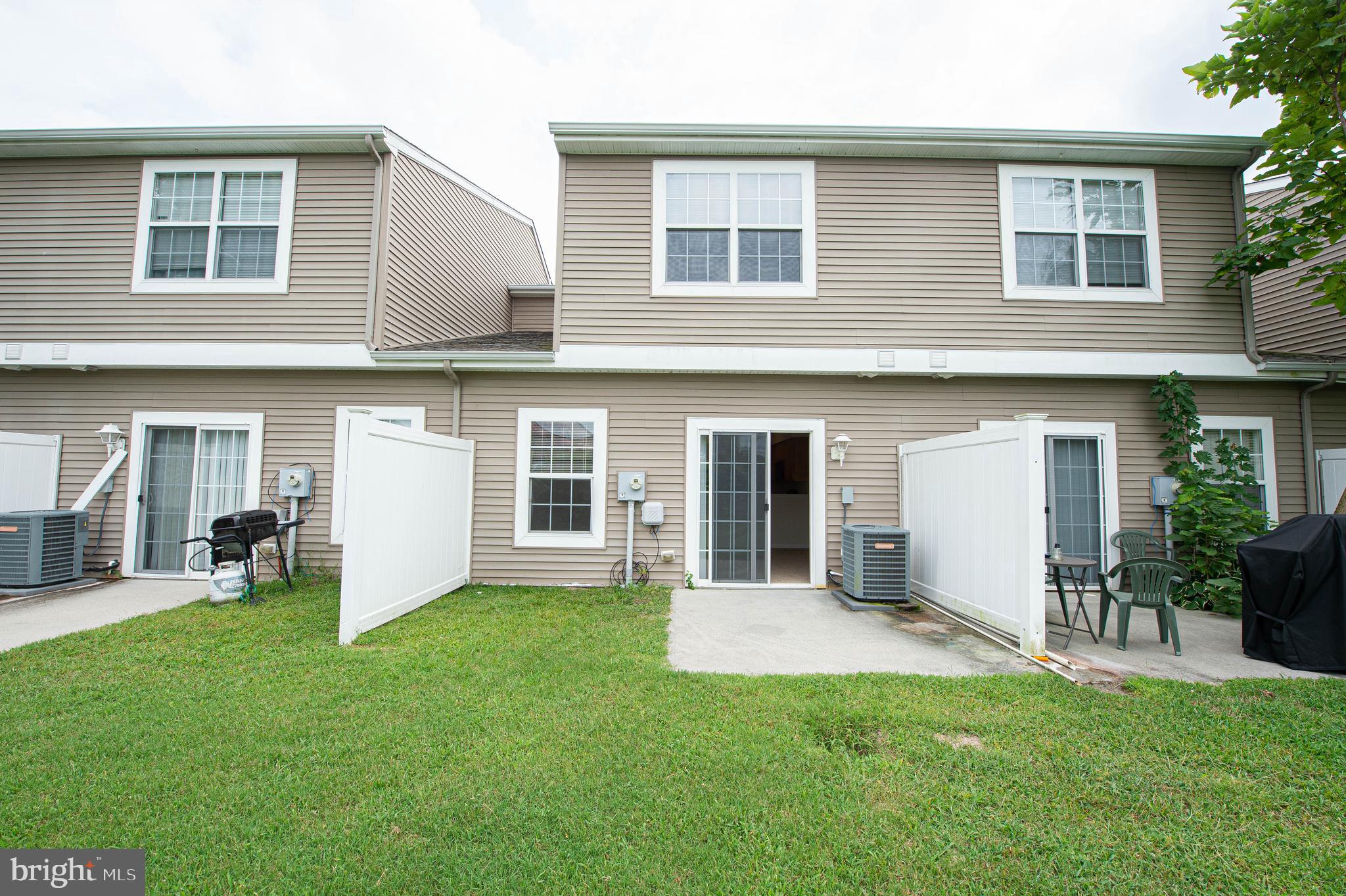 438 Parkview Court, Unit E Salisbury, MD 21804 - Photo 45 of 95 a front view of house with yard and outdoor seating