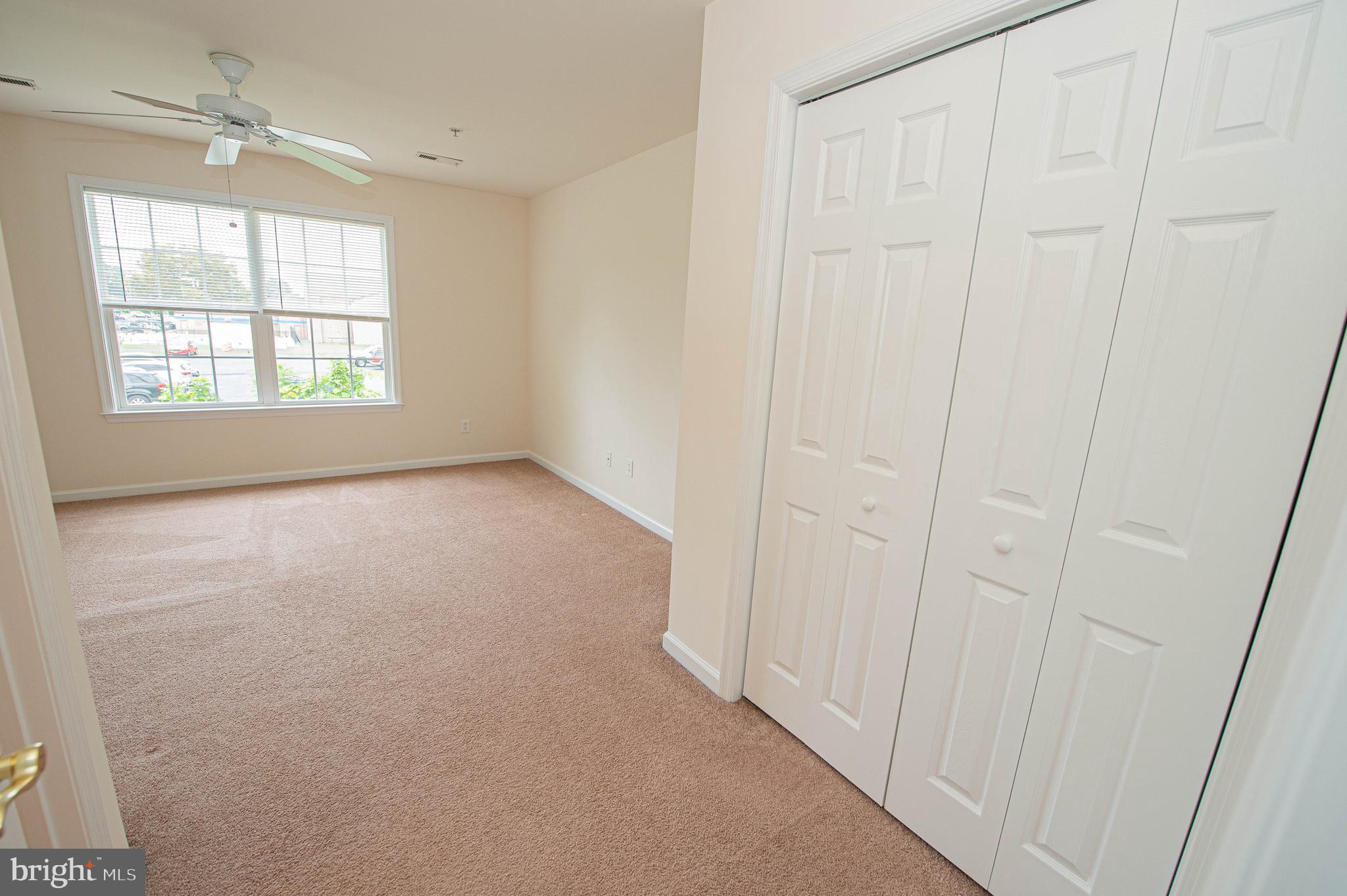 438 Parkview Court, Unit E Salisbury, MD 21804 - Photo 64 of 95 an empty room with windows