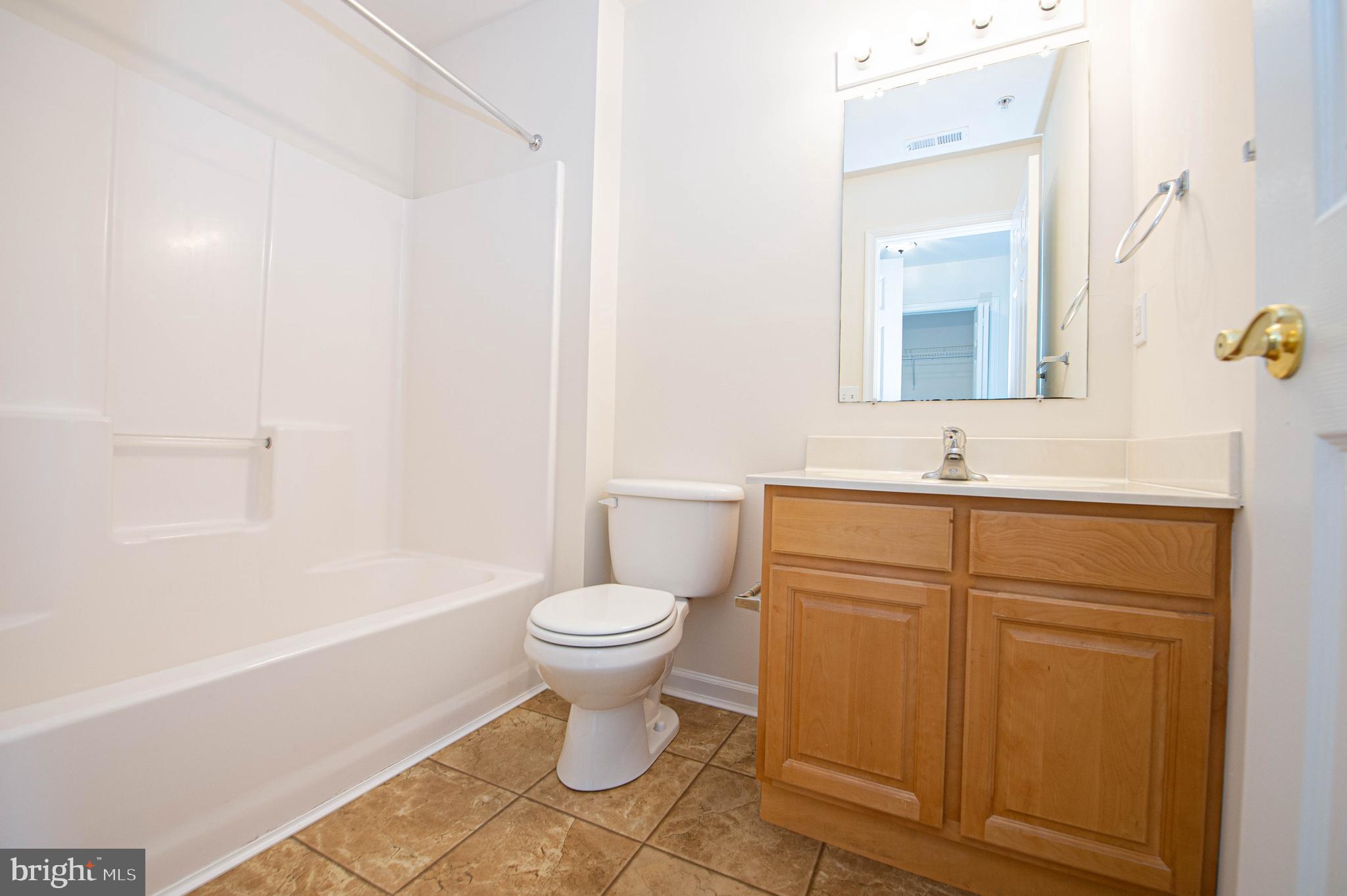 438 Parkview Court, Unit E Salisbury, MD 21804 - Photo 74 of 95 a bathroom with a sink toilet and shower