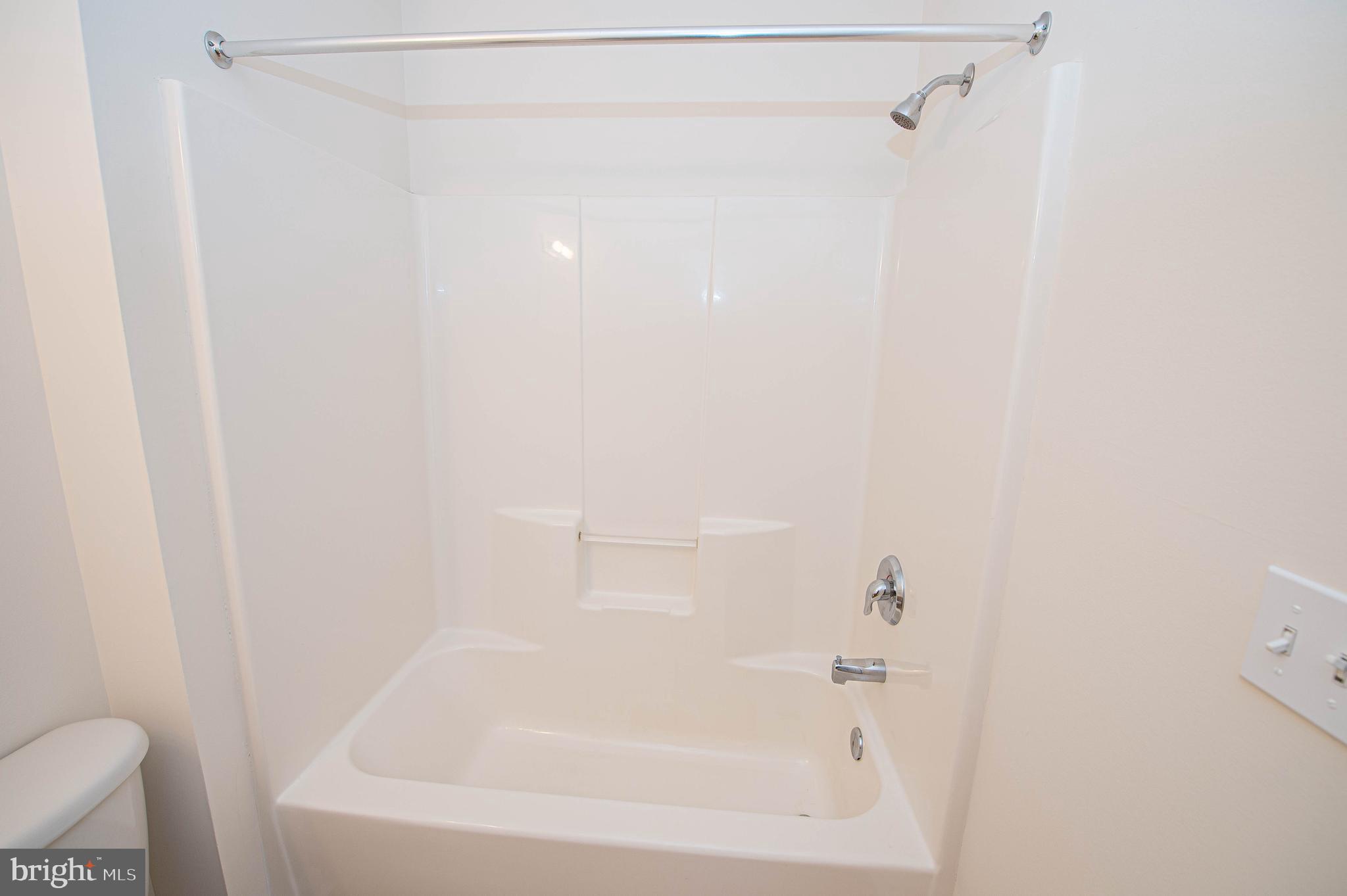 438 Parkview Court, Unit E Salisbury, MD 21804 - Photo 83 of 95 a close up of a bathtub in a bathroom