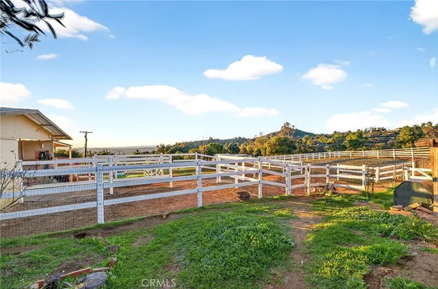 an aerial view of residential houses with outdoor space and river