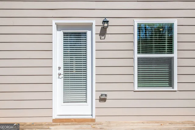 a view of a house with wooden deck