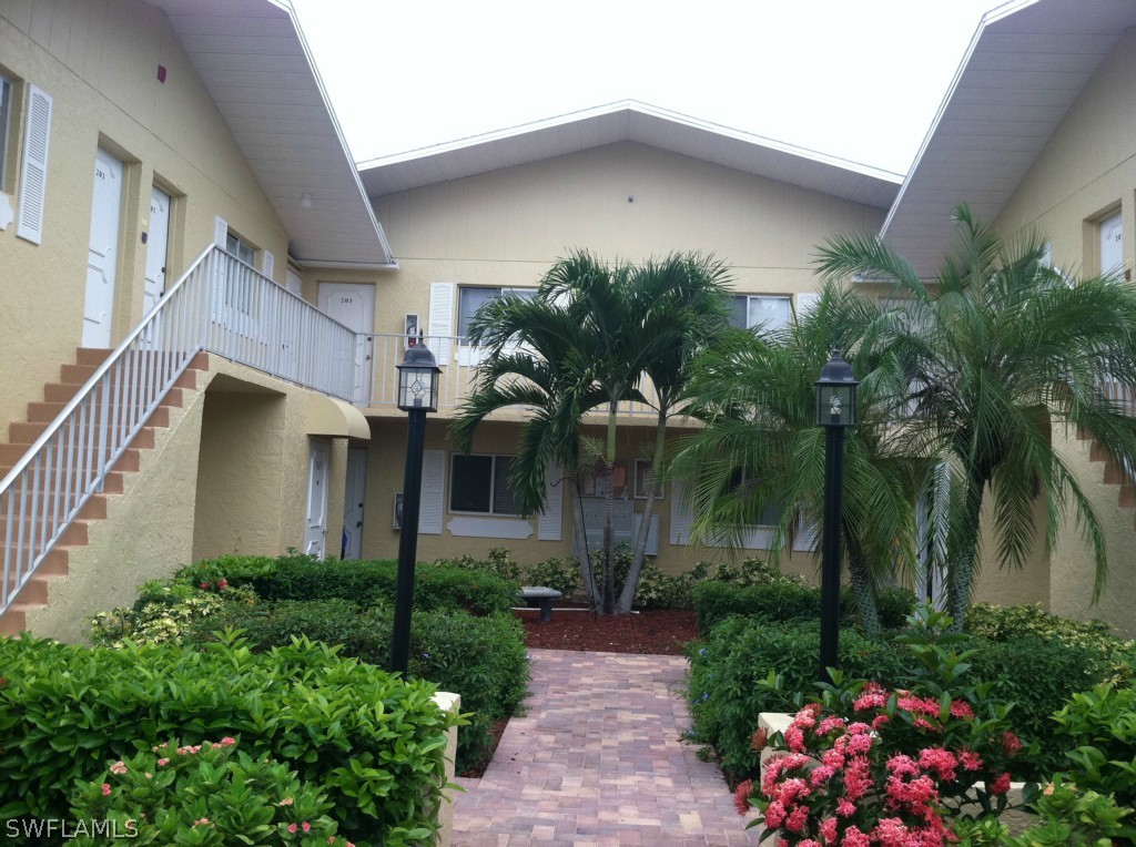 8135 Country Road Fort Myers, FL 33919 - Photo 1 of 1 a front view of a house with plants and entryway