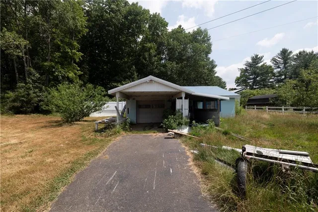 a backyard of a house with a yard and lake view