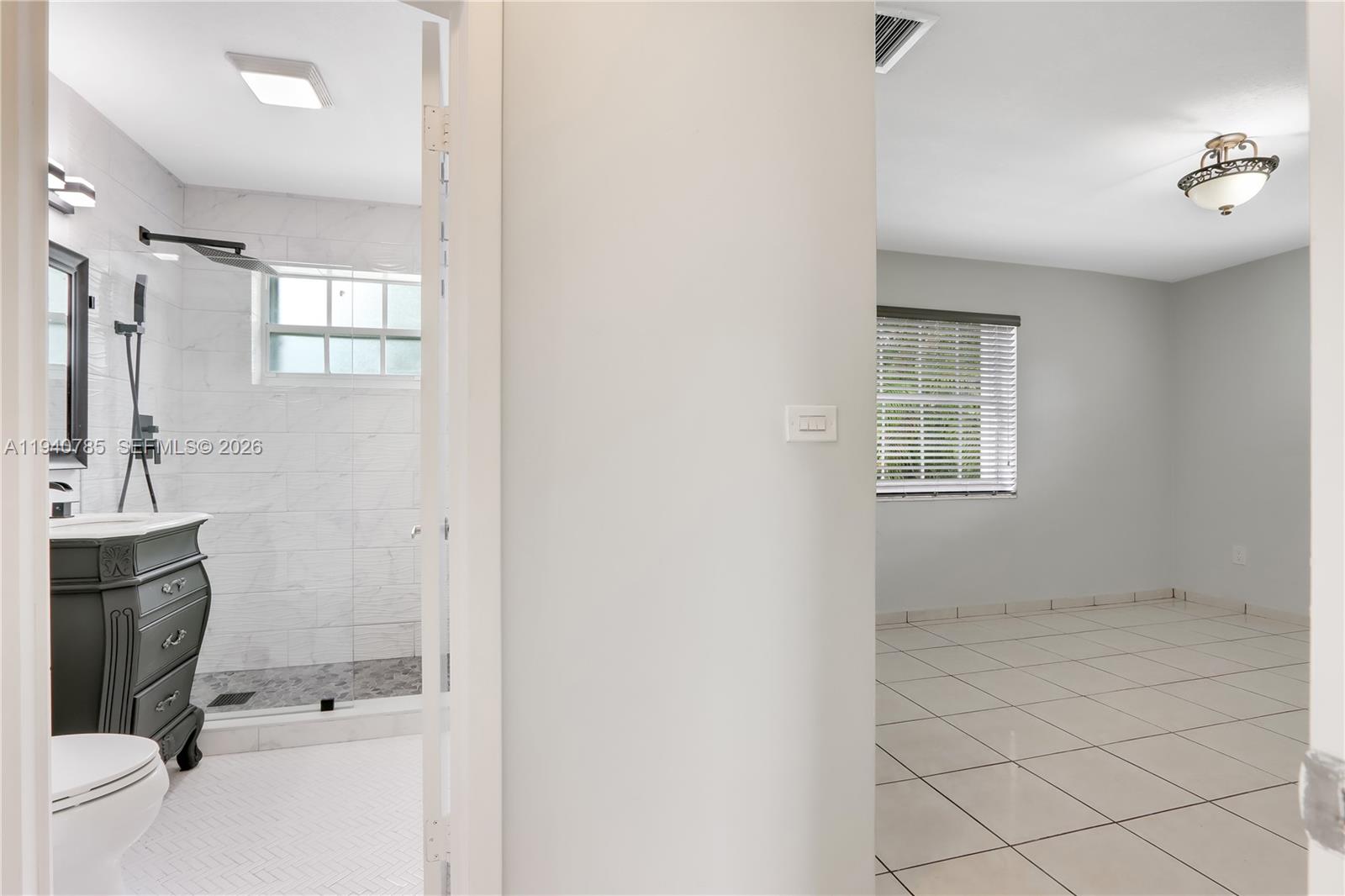 5725 Southwest 107th Place Miami, FL 33173 - Photo 11 of 21 a bathroom with a sink toilet and shower