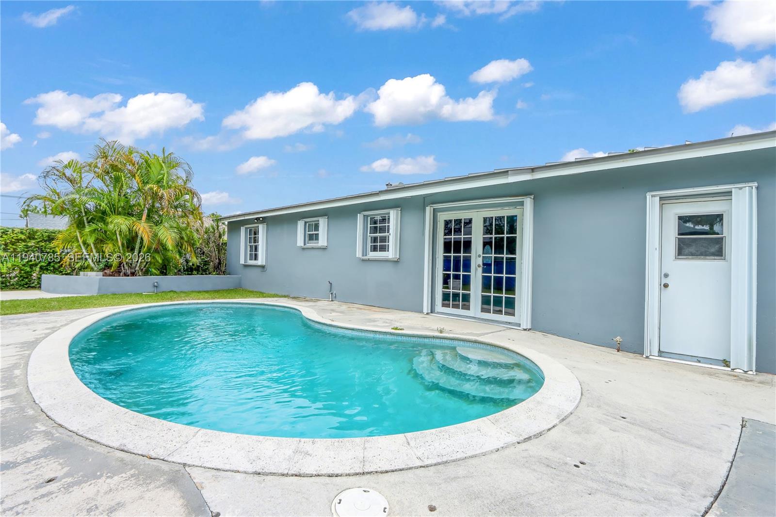 5725 Southwest 107th Place Miami, FL 33173 - Photo 3 of 21 a view of outdoor space yard swimming pool and yard