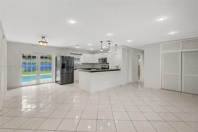 a view of kitchen appliances with cabinets