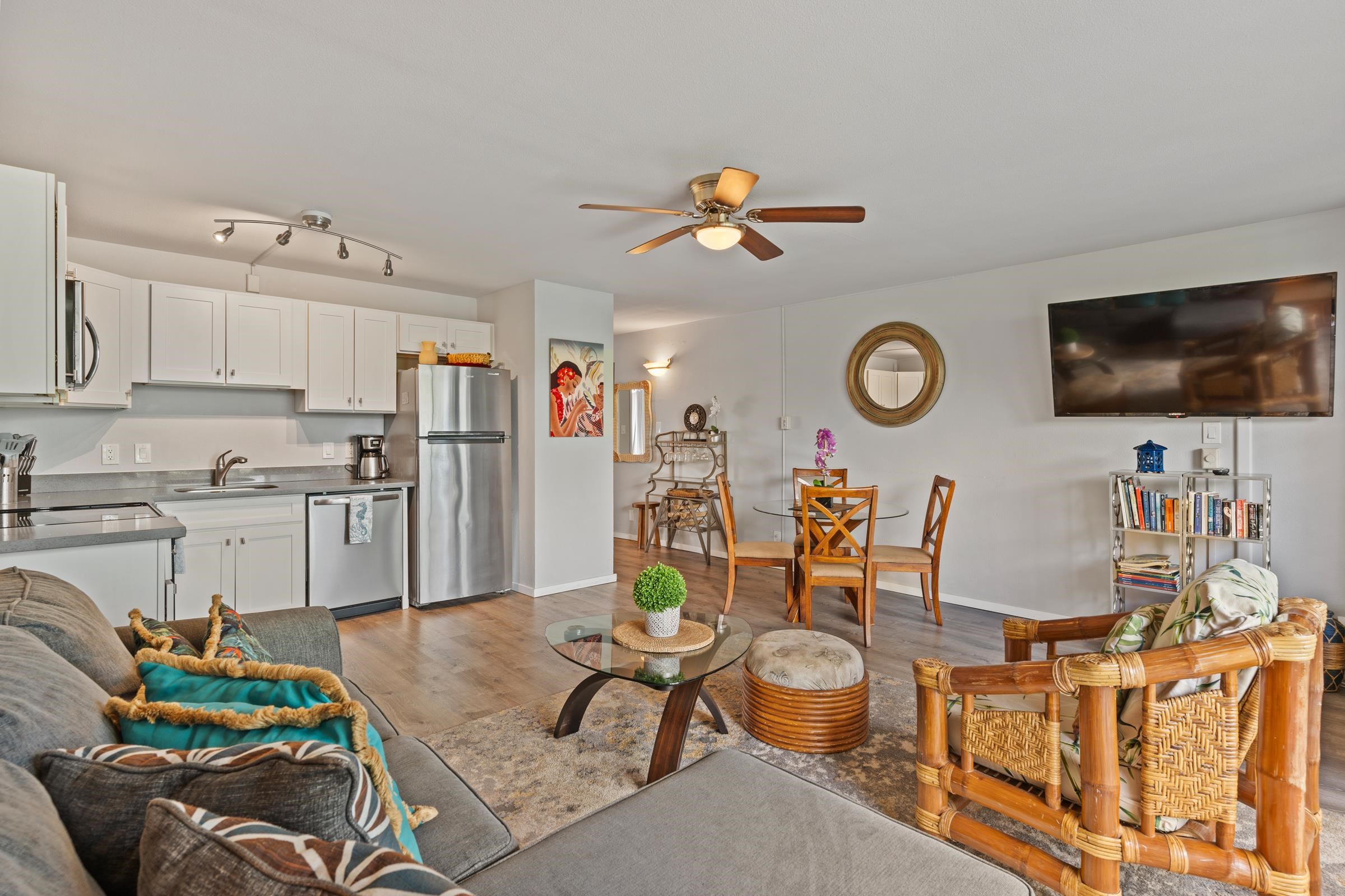 2495 South Kihei Road, Unit 155 Kihei, HI 96753 - Photo 15 of 33 a living room with furniture kitchen view and a flat screen tv