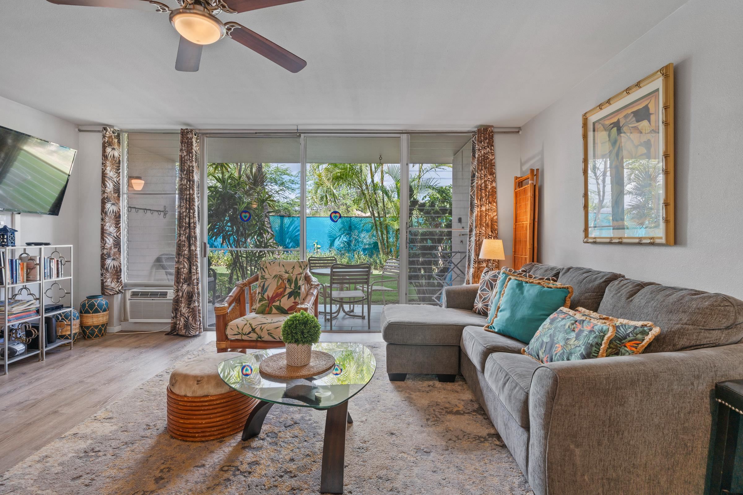 2495 South Kihei Road, Unit 155 Kihei, HI 96753 - Photo 6 of 33 a living room with furniture and a large window