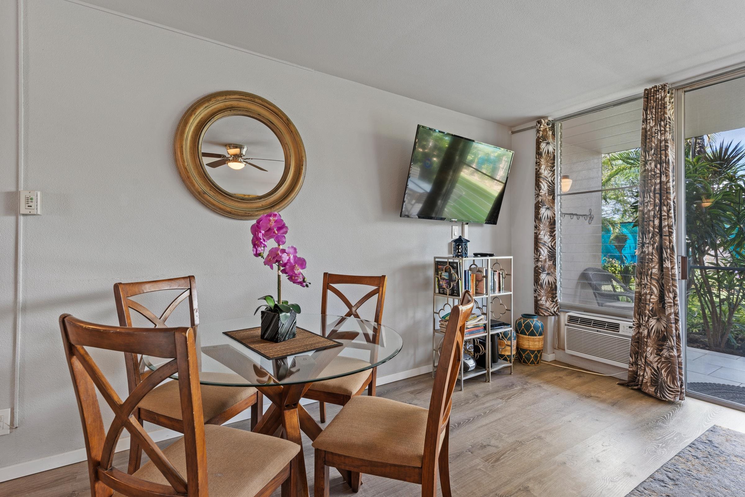 2495 South Kihei Road, Unit 155 Kihei, HI 96753 - Photo 9 of 33 a dining room with furniture and a mirror