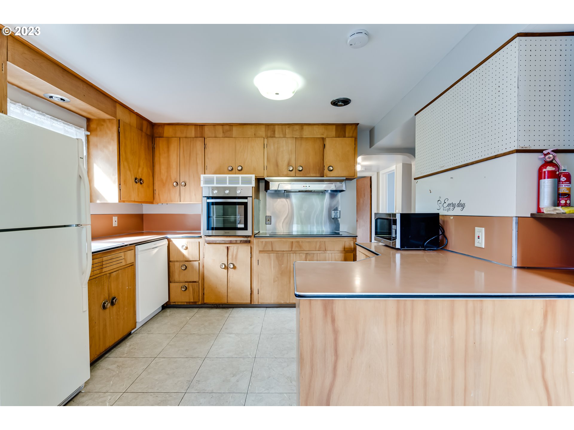 4055 North Street Springfield, OR 97478 - Photo 12 of 48 a kitchen with stainless steel appliances granite countertop a sink a stove top oven a counter space and cabinets
