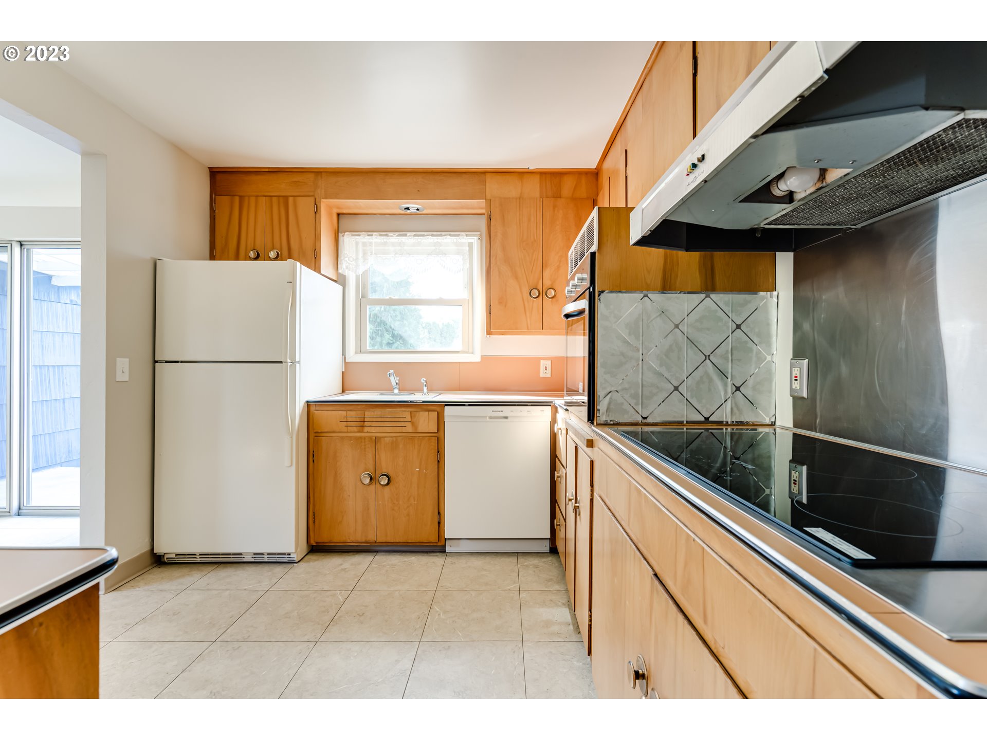 4055 North Street Springfield, OR 97478 - Photo 14 of 48 a kitchen with a refrigerator and a sink