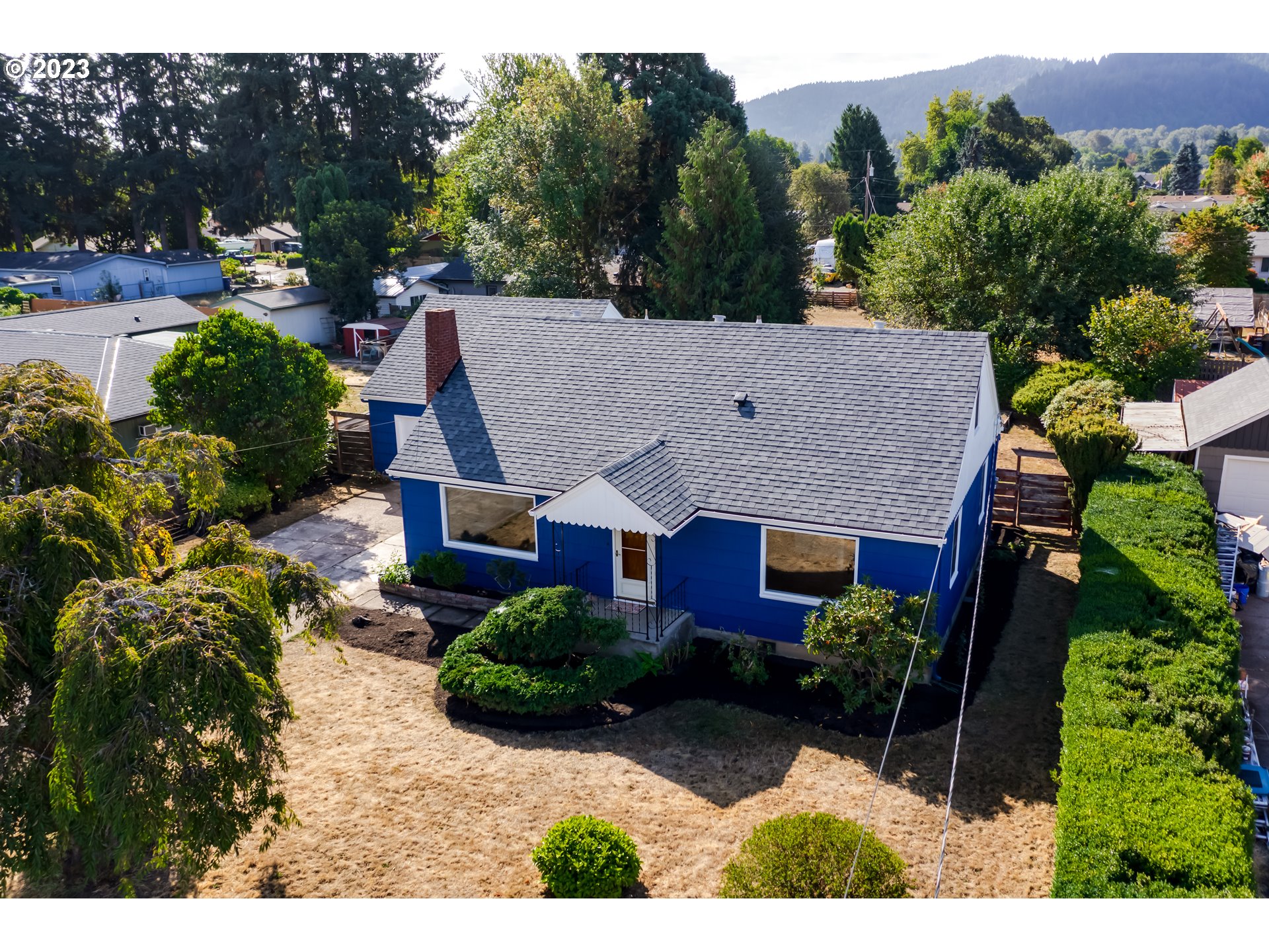 4055 North Street Springfield, OR 97478 - Photo 43 of 48 a aerial view of a house with a yard and potted plants