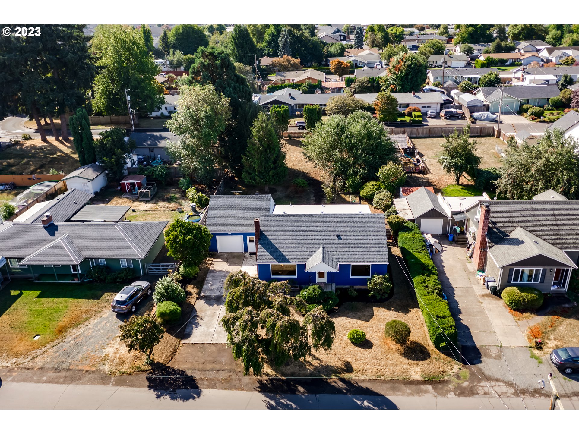 4055 North Street Springfield, OR 97478 - Photo 44 of 48 an aerial view of multiple houses with yard