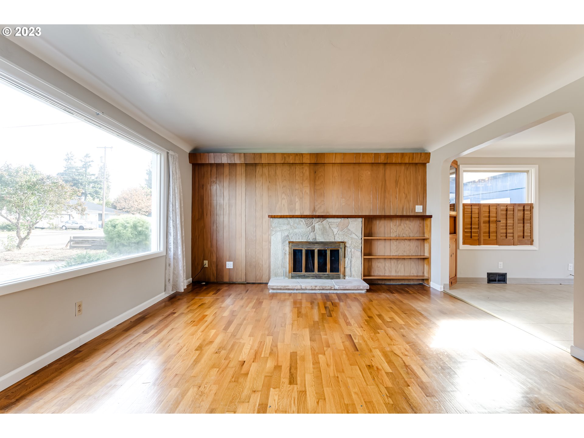 4055 North Street Springfield, OR 97478 - Photo 5 of 48 a view of empty room with a fireplace and window
