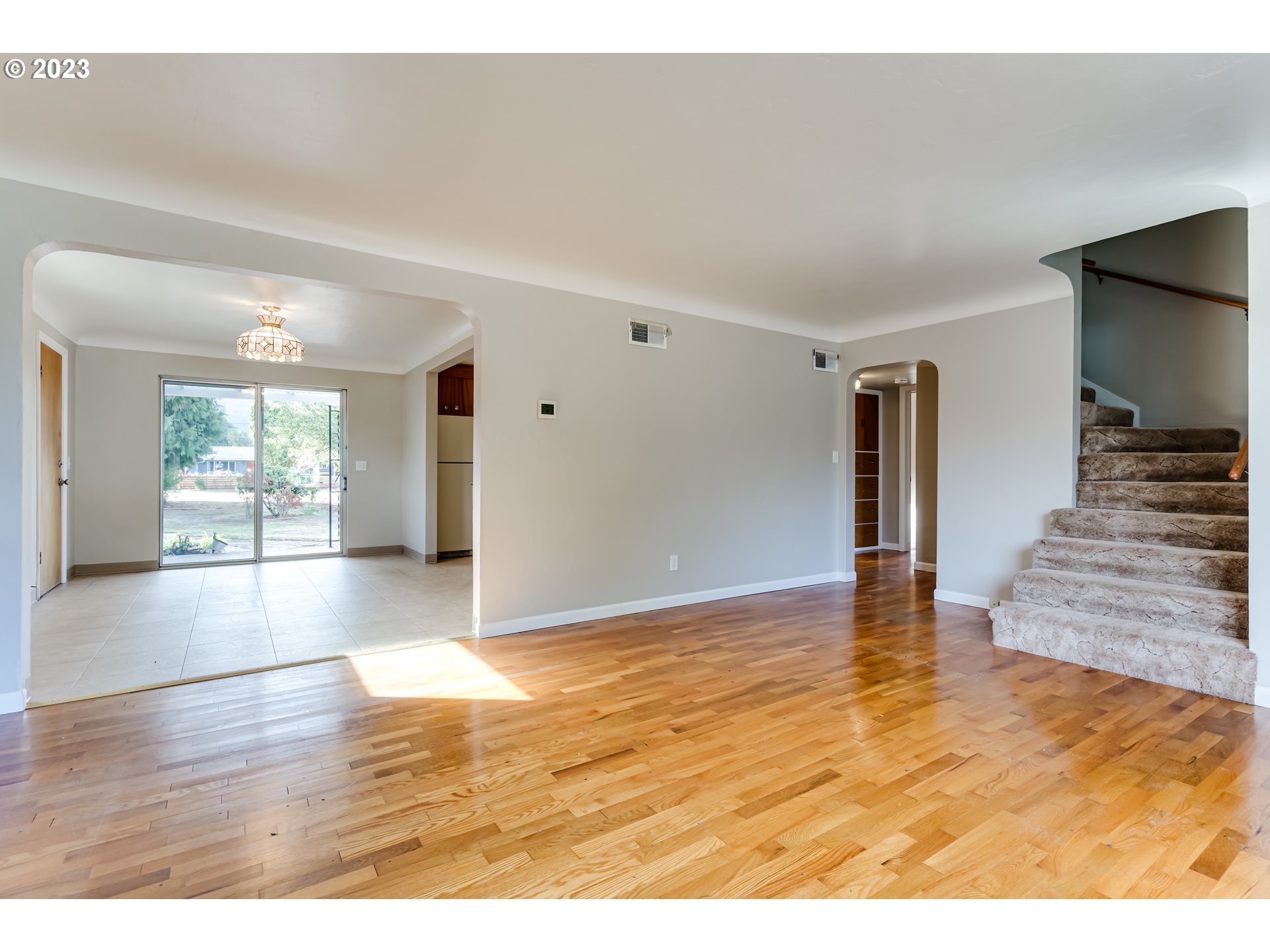 4055 North Street Springfield, OR 97478 - Photo 8 of 48 a view of an empty room with window and wooden floor